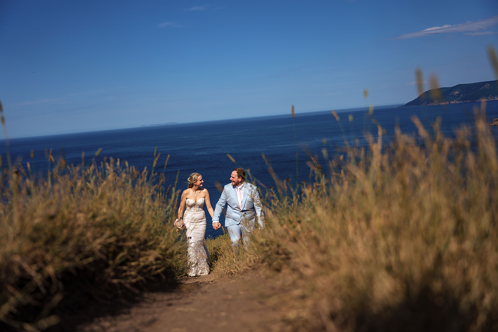 Couple deciding between an elopement and a small wedding during a Nova Scotia coastal ceremony.